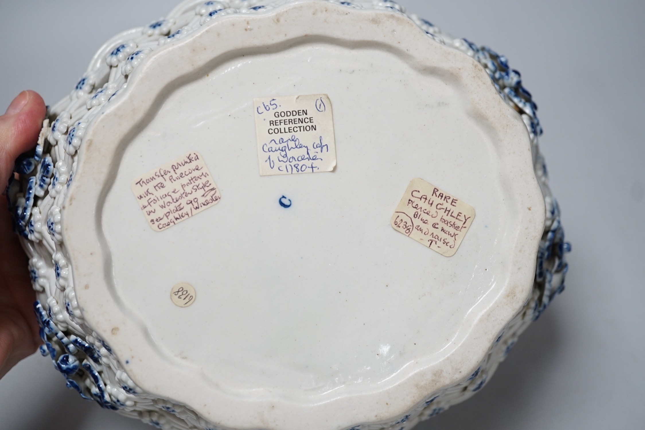 An 18th century Caughley basket printed with fir cones, under a painted border, C mark and very rare IT moulded mark, verso, Ex-Godden Reference Collection, 22cms wide